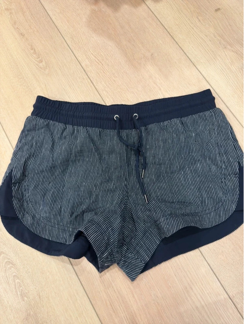 Athleta Navy Pinstripe Drawstring Running Shorts Curved Hem Pockets
